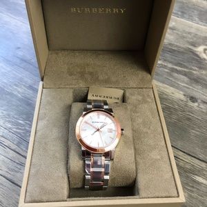 Burberry watch silver with rose gold accents.